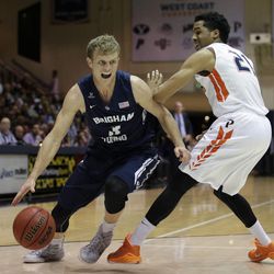 BYU's Tyler Haws, left, drives past Pepperdine's Shawn Olden during the first half of an NCAA college basketball game Thursday, Feb. 5, 2015, in Malibu, Calif.