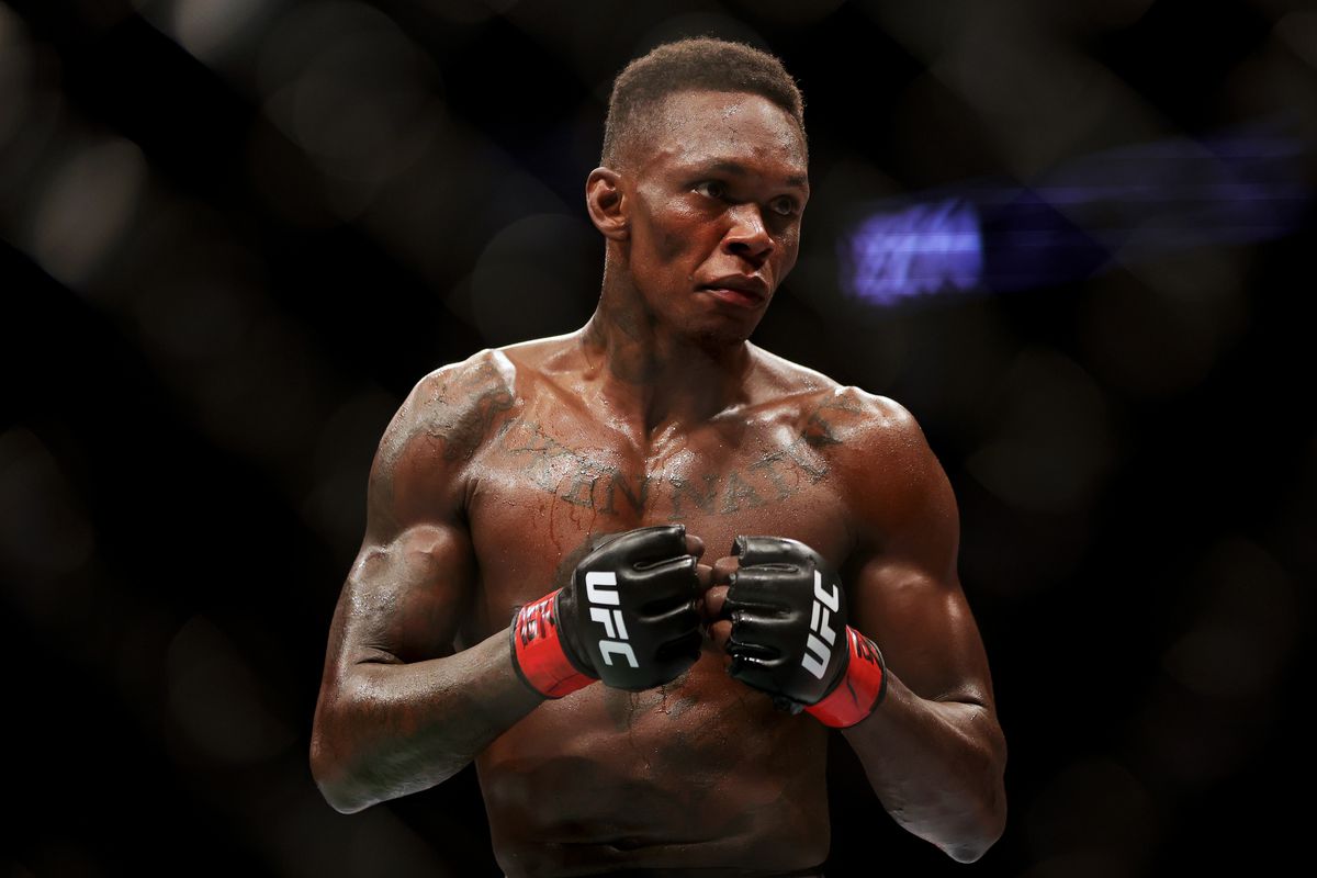 Israel Adesanya of Nigeria looks on in his middleweight championship fight against Robert Whittaker of Australia during UFC 271 at Toyota Center on February 12, 2022 in Houston, Texas.