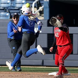 BYU's Rylee Jensen is safe at first base as Utah's Alyssa Palacios makes the catch as BYU and Utah play in a softball game at BYU in Provo on Wednesday, May 1, 2019. Utah won 11-2.