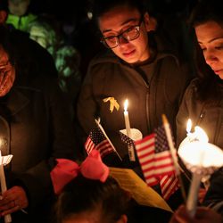 The family of Pedro Barboza Flores stands together at a vigil honoring Maj. Brent Taylor outside his home in North Ogden on Wednesday, Nov. 7, 2018. Taylor, mayor of North Ogden and a major in the Utah Army National Guard, was killed in Afghanistan on Saturday. Flores was killed in Afghanistan in 2009. From left is Aurora Barboza, Karina, Barboza, Mayra Barboza and Mia Barboza.