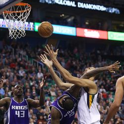 Utah Jazz center Rudy Gobert (27) is fouled by Sacramento Kings forward DeMarcus Cousins (15) as the Jazz and the Kings play at Vivint Smart Home arena in Salt Lake City on Wednesday, Dec. 21, 2016.