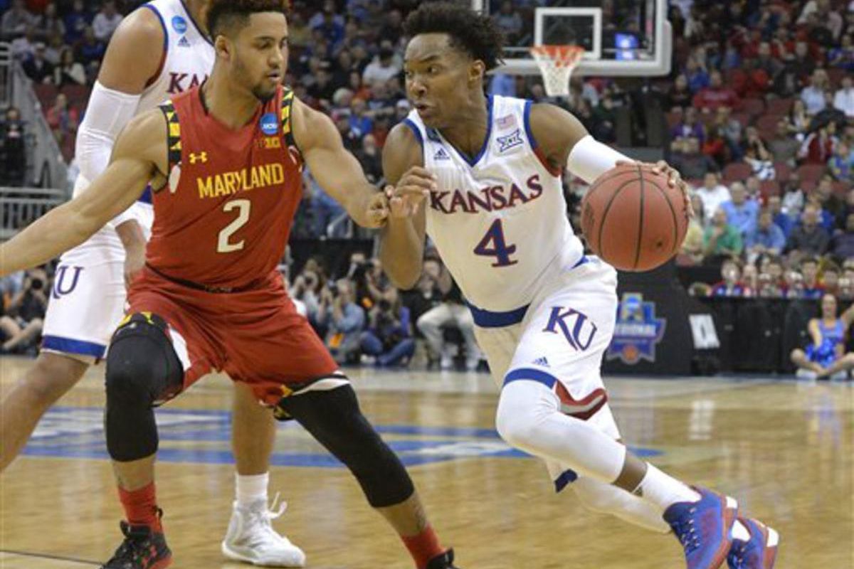 Kansas guard Devonte' Graham (4) drives against Maryland guard Melo Trimble (2) during the first half of an NCAA college basketball game in the regional semifinals of the men's NCAA Tournament in Louisville, Ky., Thursday, March 24, 2016. (AP Photo/Timoth