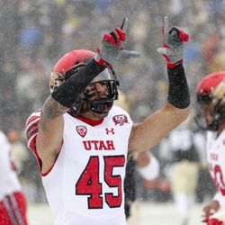 Utah Utes wide receiver Samson Nacua (45) holds up the "U" sign after catching a touchdown pass during the University of Utah football game against the University of Colorado at Folsom Field in Boulder, Colorado, on Saturday, Nov. 17, 2018.