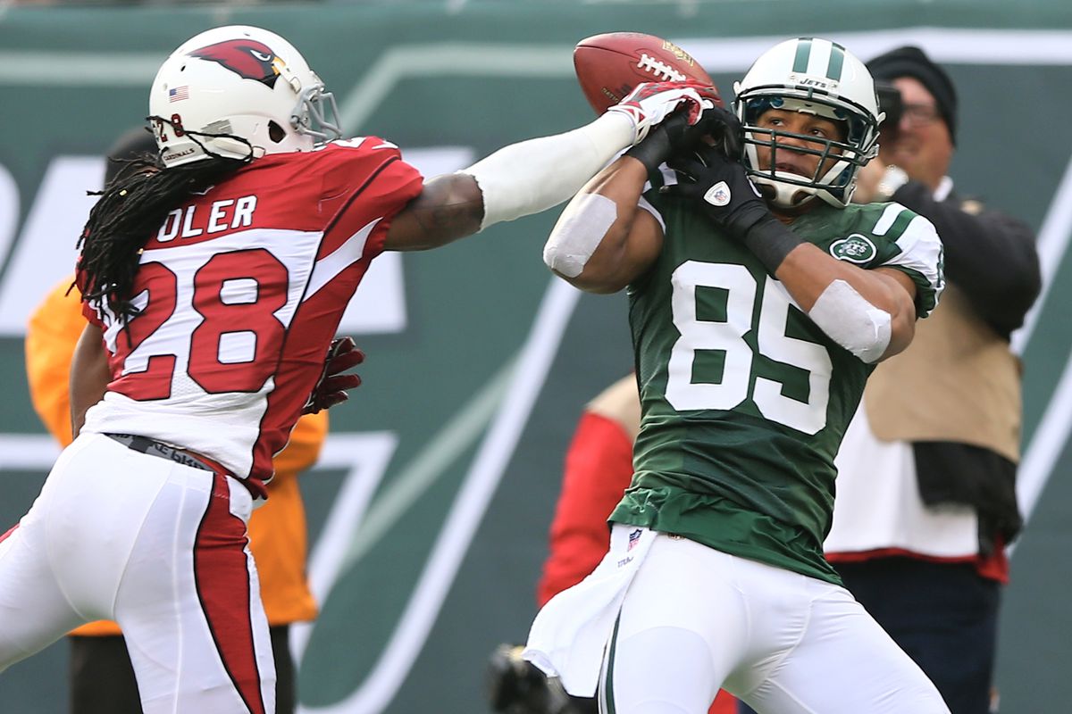 Greg Toler knocks the ball from Chaz Schilens of the New York Jets during a 2012 game