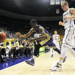 Prairie View A&M Panthers guard Montrael Scott (31) scrambles for a loose ball in front of BYU forward Eric Mika (00) during a game at the Marriott Center in Provo on Wednesday, Dec. 11, 2013.
