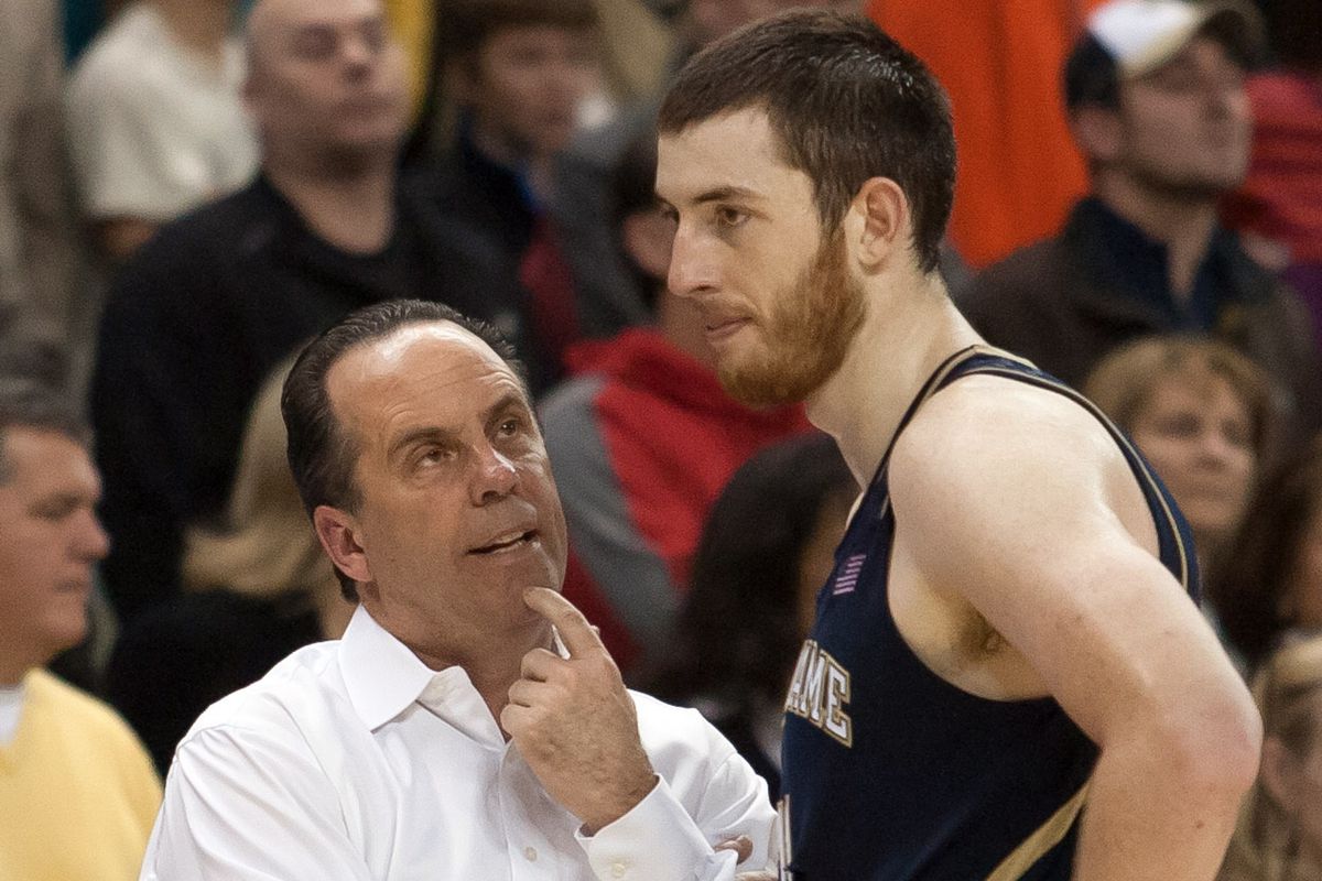 Mike Brey and Garrick Sherman likely discussing advanced metrics on the sidelines of the Wake game
