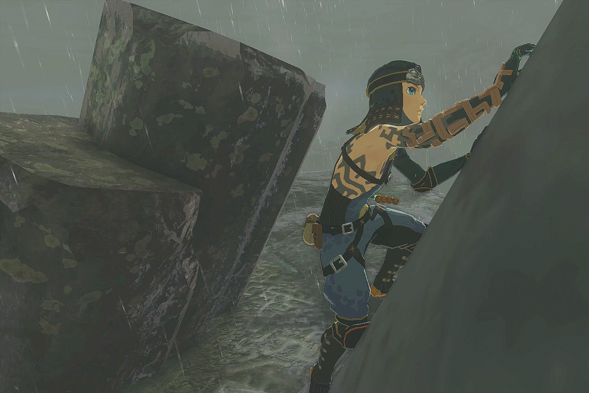 The Legend of Zelda: Tears of the Kingdom Link wearing the Froggy Armor set and climbing a rock in the rain