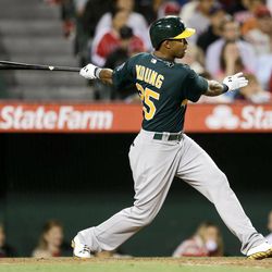 Oakland Athletics' Chris Young watches his two-RBI double against the Los Angeles Angels during the sixth inning of a baseball game in Anaheim, Calif., Thursday, April 11, 2013. 