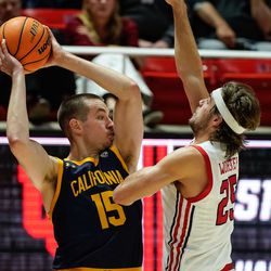 California forward Grant Anticevich looks to pass past Utah guard Rollie Worster, right, during an NCAA game at the Huntsman Center in Salt Lake City on Sunday, Dec. 5, 2021.