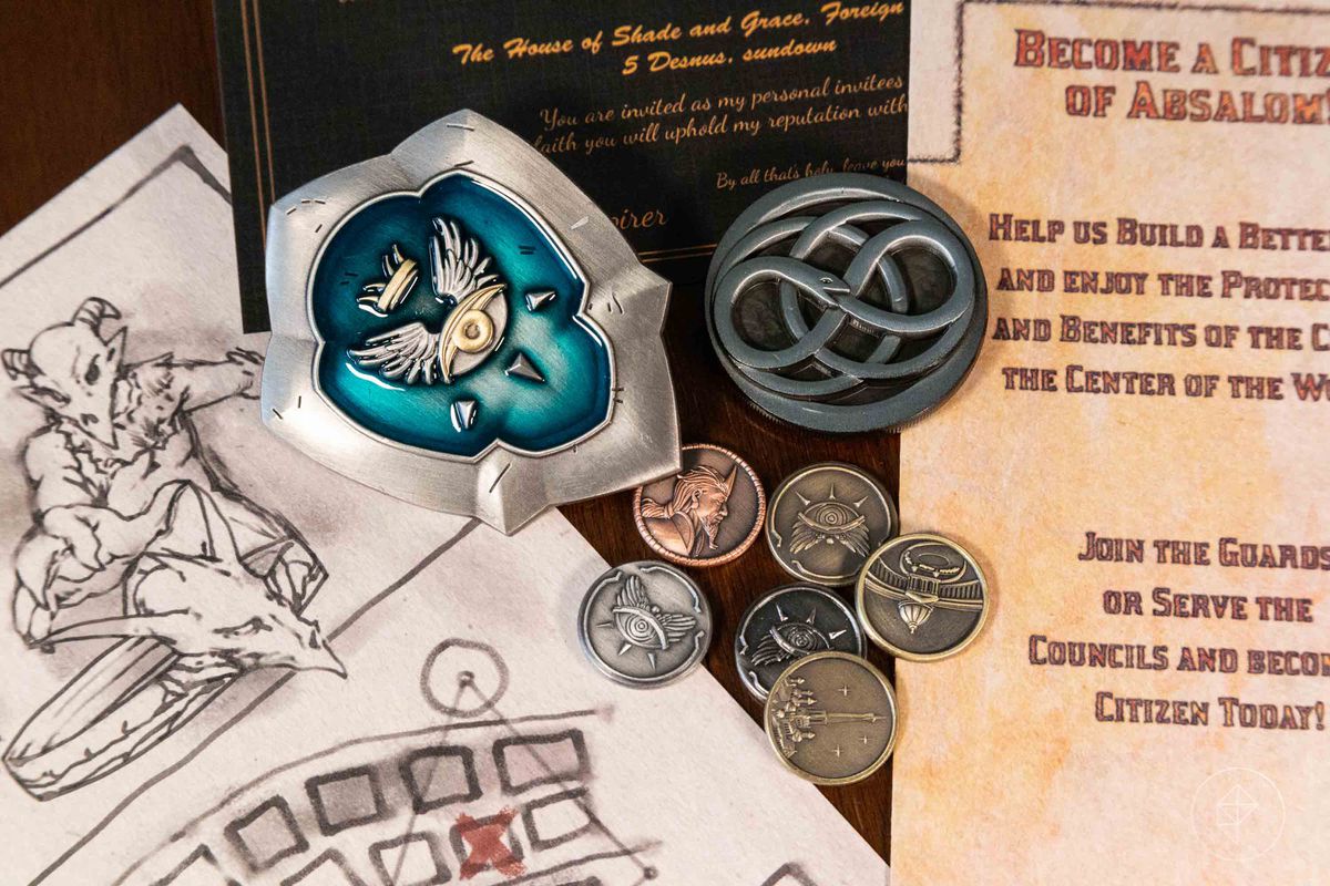 A close-up shot of a pin and some coins, plus handouts for players.
