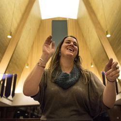 Director Katie Lay conducts the Wesley Bell Choir during a practice session at Christ United Methodist Church in Salt Lake City on Tuesday, Nov. 29, 2016. The choir has been a ministry at the church for over 50 years and will be performing its holiday concert throughout the month. Lay was a member of the bell choir while in high school and college, and she loves seeing teenagers come together and prove doubters wrong. "What always strikes me is when people come up to us at the end of the show in tears and in shock of how teenagers can do this together," Lay said.