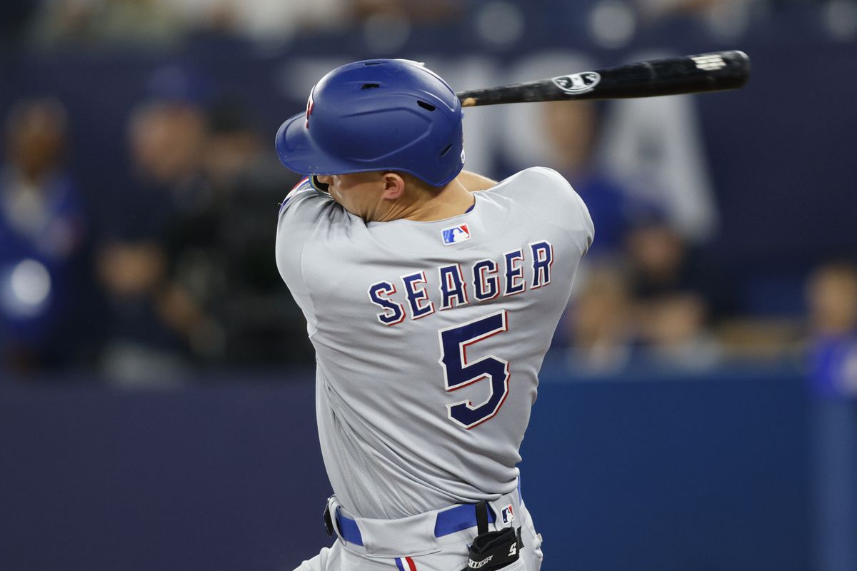 Corey Seager of the Texas Rangers swings in the first inning of their MLB game against the Toronto Blue Jays at Rogers Centre on September 12, 2023 in Toronto, Canada.
