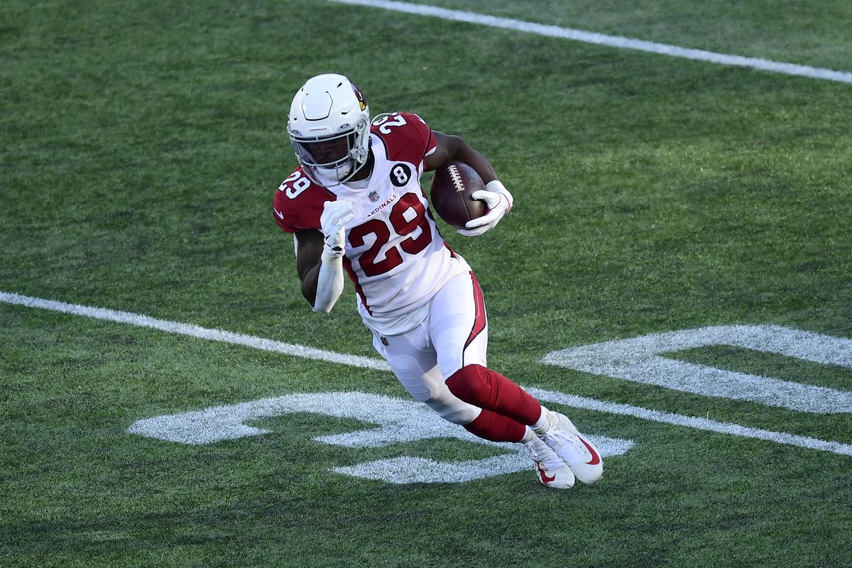Chase Edmonds #29 of the Arizona Cardinals carries the ball during the first half of a game against the New England Patriots at Gillette Stadium on November 29, 2020 in Foxborough, Massachusetts. 