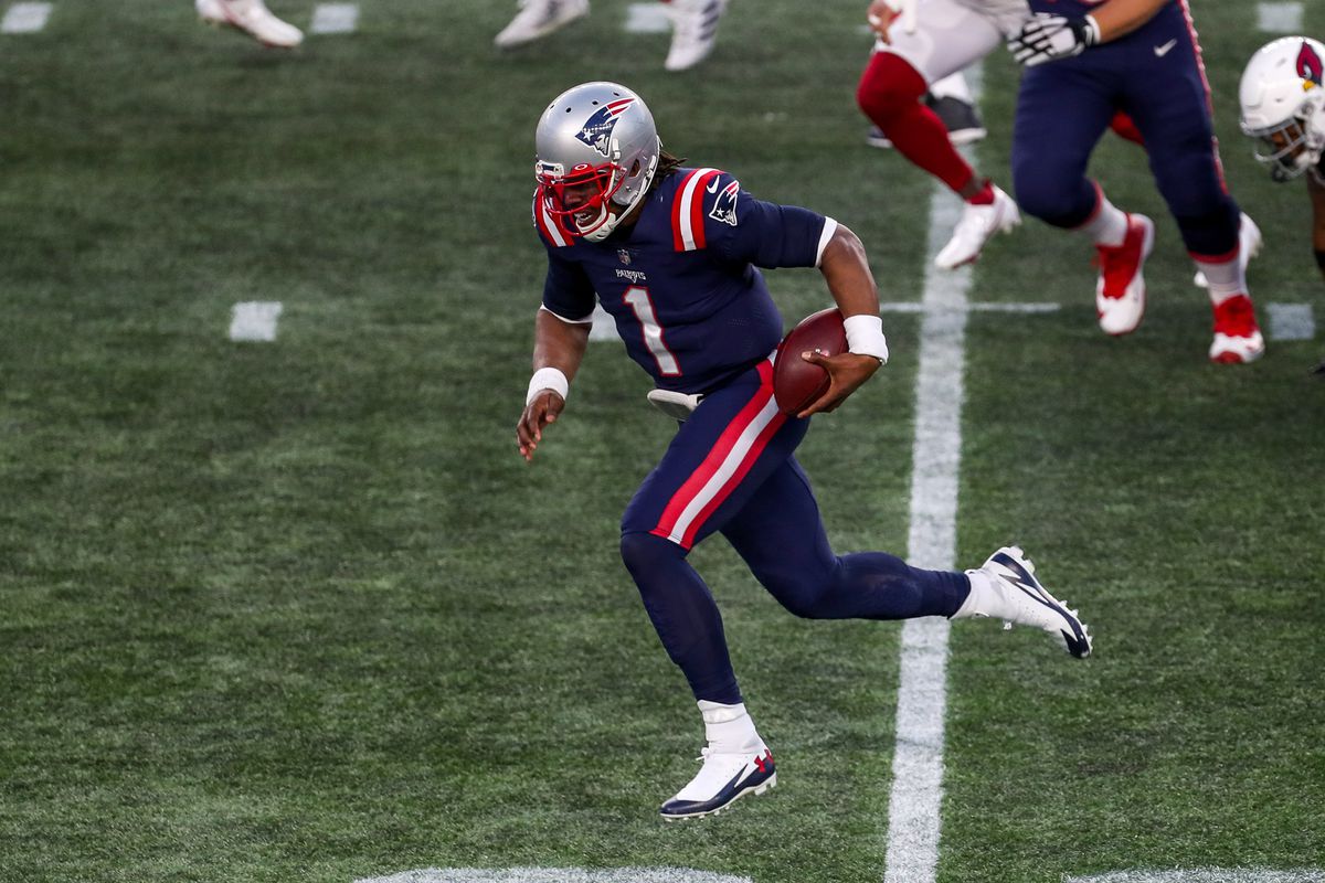 New England Patriots quarterback Cam Newton runs the ball against the Arizona Cardinals during the second half at Gillette Stadium.&nbsp;