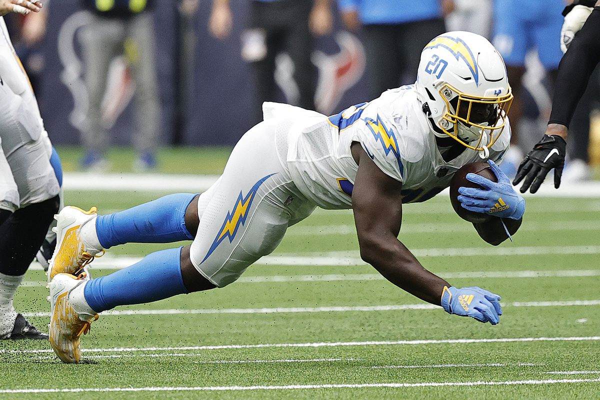 Sony Michel #20 of the Los Angeles Chargers rushes with the ball against the Houston Texans at NRG Stadium on October 02, 2022 in Houston, Texas.