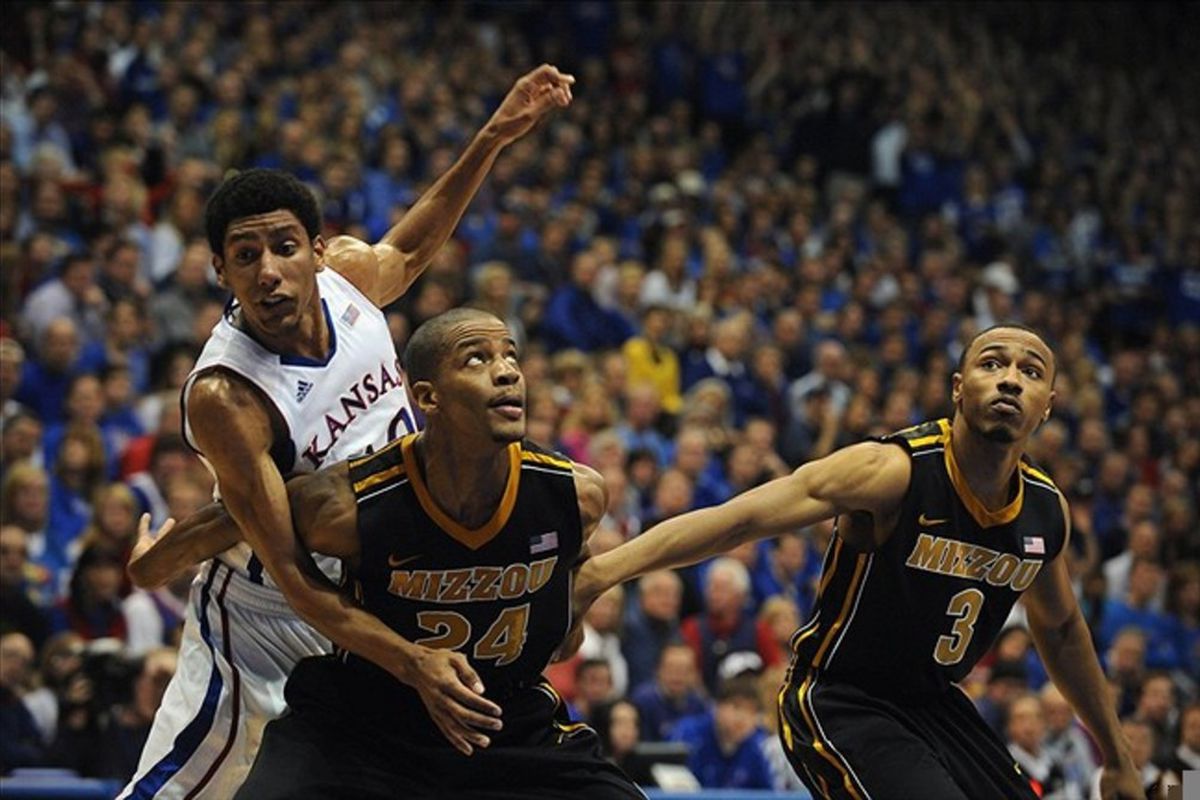 Feb 25, 2012; Lawrence, KS, USA; Kansas Jayhawks guard Kevin Young (40) is blocked by Missouri Tigers guards Kim English (24) and Matt Pressey (3) in the first half at Allen Fieldhouse. Mandatory Credit: John Rieger-US PRESSWIRE
