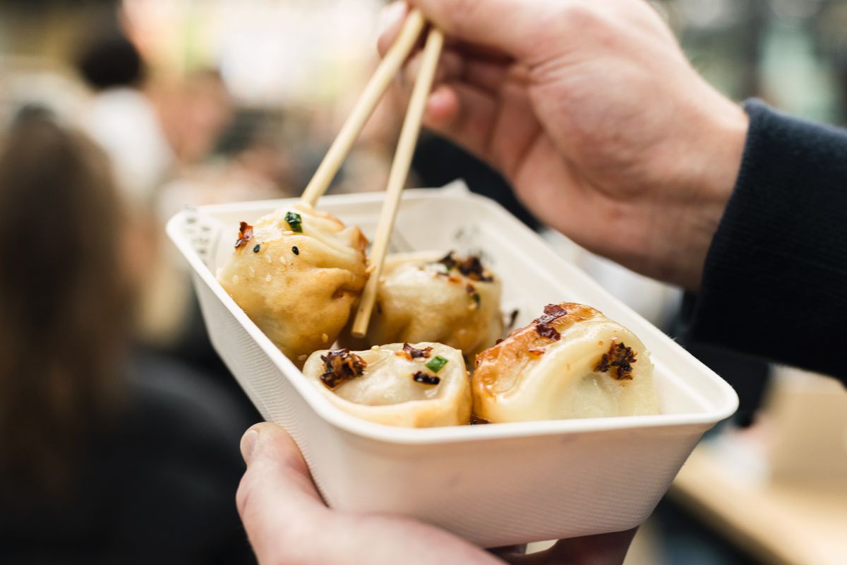 London’s best Chinese dumplings include these sheng jian bao at Dumpling Shack, served in a white takeaway box.