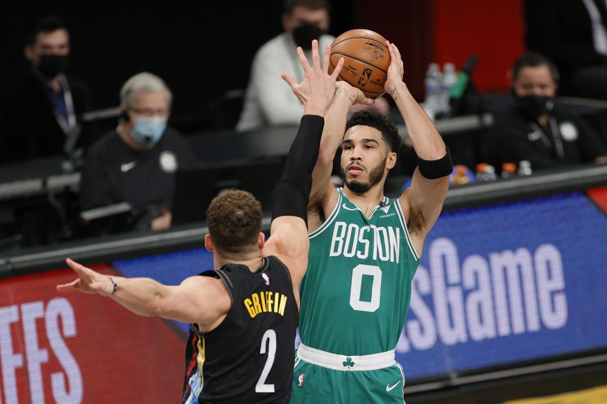 Jayson Tatum of the Boston Celtics shoots as Blake Griffin of the Brooklyn Nets defends during the first half of Game Two of their Eastern Conference first-round playoff series at Barclays Center on May 25, 2021 in the Brooklyn borough of New York City.