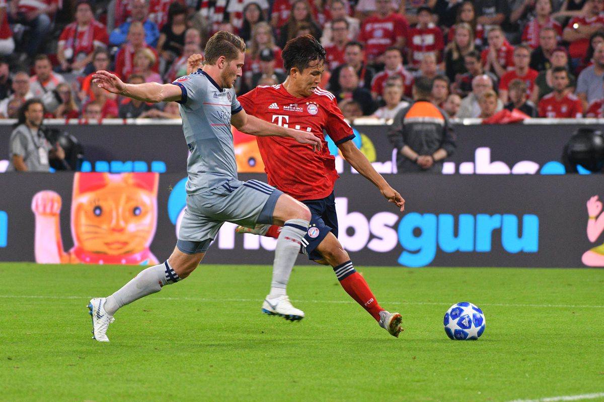 FC Bayern Muenchen v Chicago Fire - Friendly Match
MUNICH, GERMANY - AUGUST 28: Djordje Mihailovic of Chicago Fire and Wooyeong Jeong of Bayern Muenchen battle for the ball during the friendly match between FC Bayern Muenchen and Chicago Fire at Allianz Arena on August 28, 2018 in Munich, Germany.