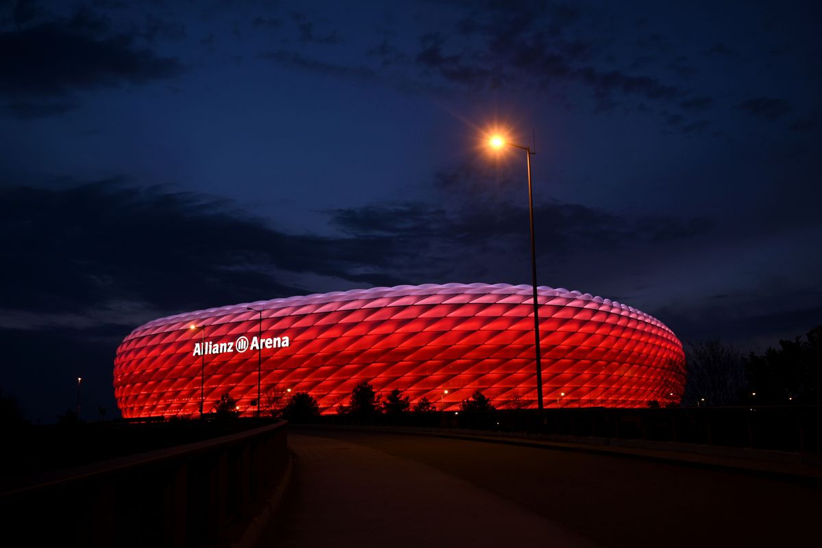 A picture taken on April 17, 2020 shows a view of the Allianz Arena football stadium lighted in red in Munich, southern Germany.