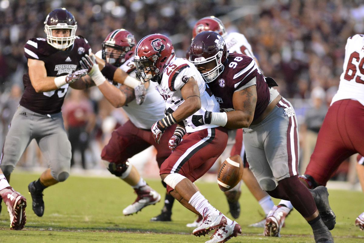Mississippi St. Bulldogs CL Jeffery Simmons forces a fumble from South Carolina Gamecocks RB A.J. Turner, Sep. 10, 2016.