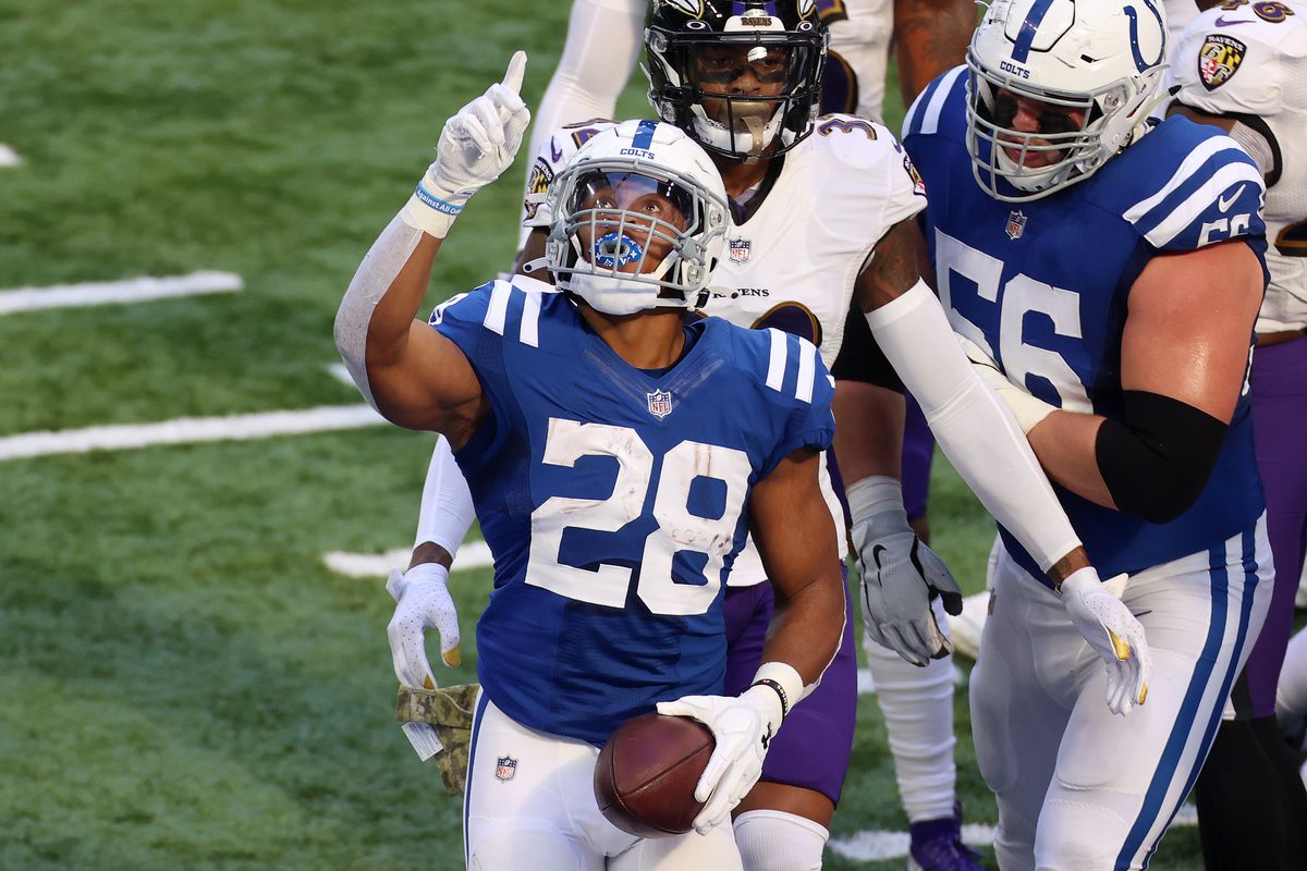 Jonathan Taylor #28 of the Indianapolis Colts celebrates a touchdown against the Baltimore Ravens during the first quarter at Lucas Oil Stadium on November 08, 2020 in Indianapolis, Indiana.