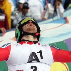 Ted Ligety, of the United States, celebrates in the finish area after winning an alpine ski, men's World Cup giant slalom, in Soelden, Austria, Sunday, Oct. 25 2015. (AP Photo/Marco Trovati)