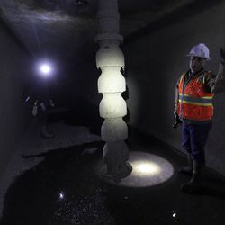 Chris Hogge, Weber Basin Water Conservancy manager of water supply and power, shows a pump inside the 3.3-mile Gateway Tunnel that serves the Weber Basin Water Conservancy District near Mountain Green on Wednesday, Feb. 26, 2020.