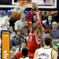 Houston Rockets power forward Dwight Howard (12) puts down a dunk during a game at EnergySolutions Arena on Monday, Dec. 2, 2013.