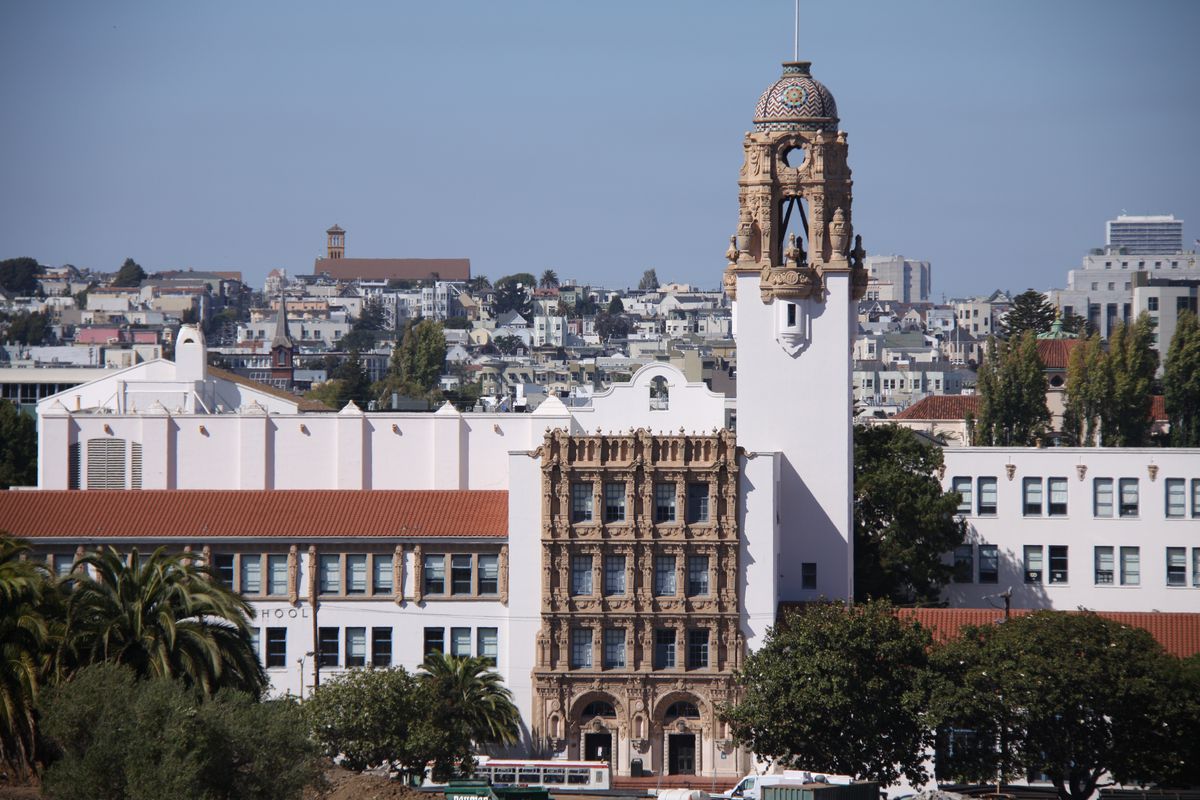 Mission High School, a mission revival building with an elaborate baroque bell tower.