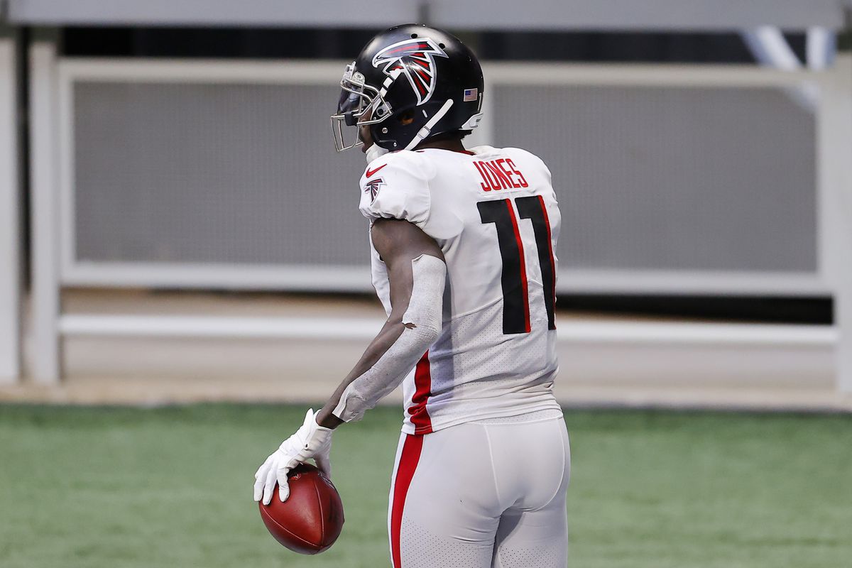 Julio Jones #11 of the Atlanta Falcons reacts after scoring a touchdown during the third quarter against the Denver Broncos at Mercedes-Benz Stadium on November 08, 2020 in Atlanta, Georgia.