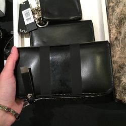 Black zip wallet, $87 (was $350)