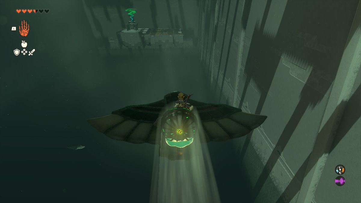 Link rides a wing with a fan attached to it across a chasm in the Jirutagumac Shrine in Zelda Tears of the Kingdom.