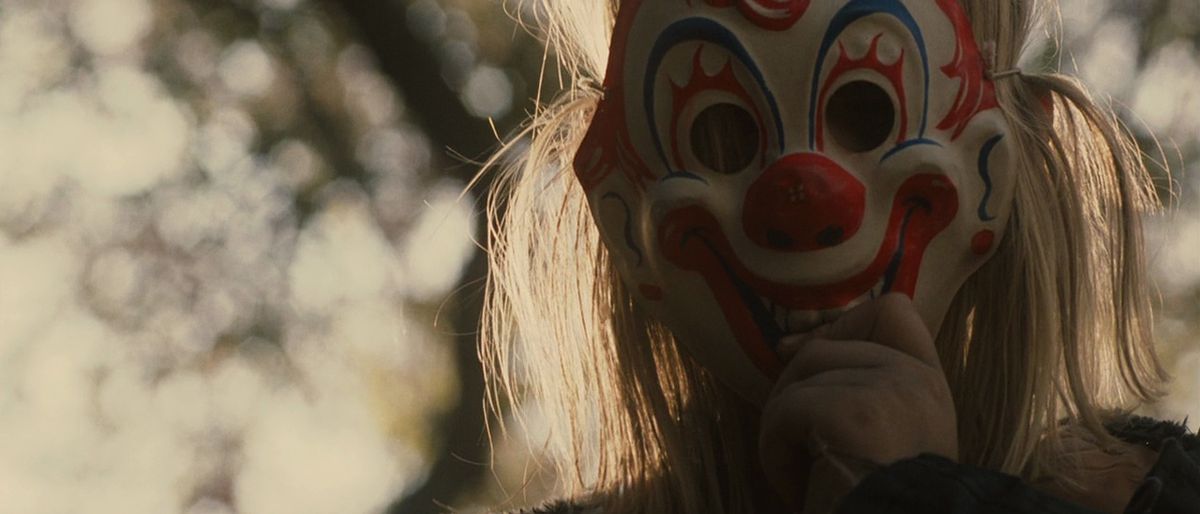 Young Michael Myers wears a clown mask in Rob Zombie’s Halloween.