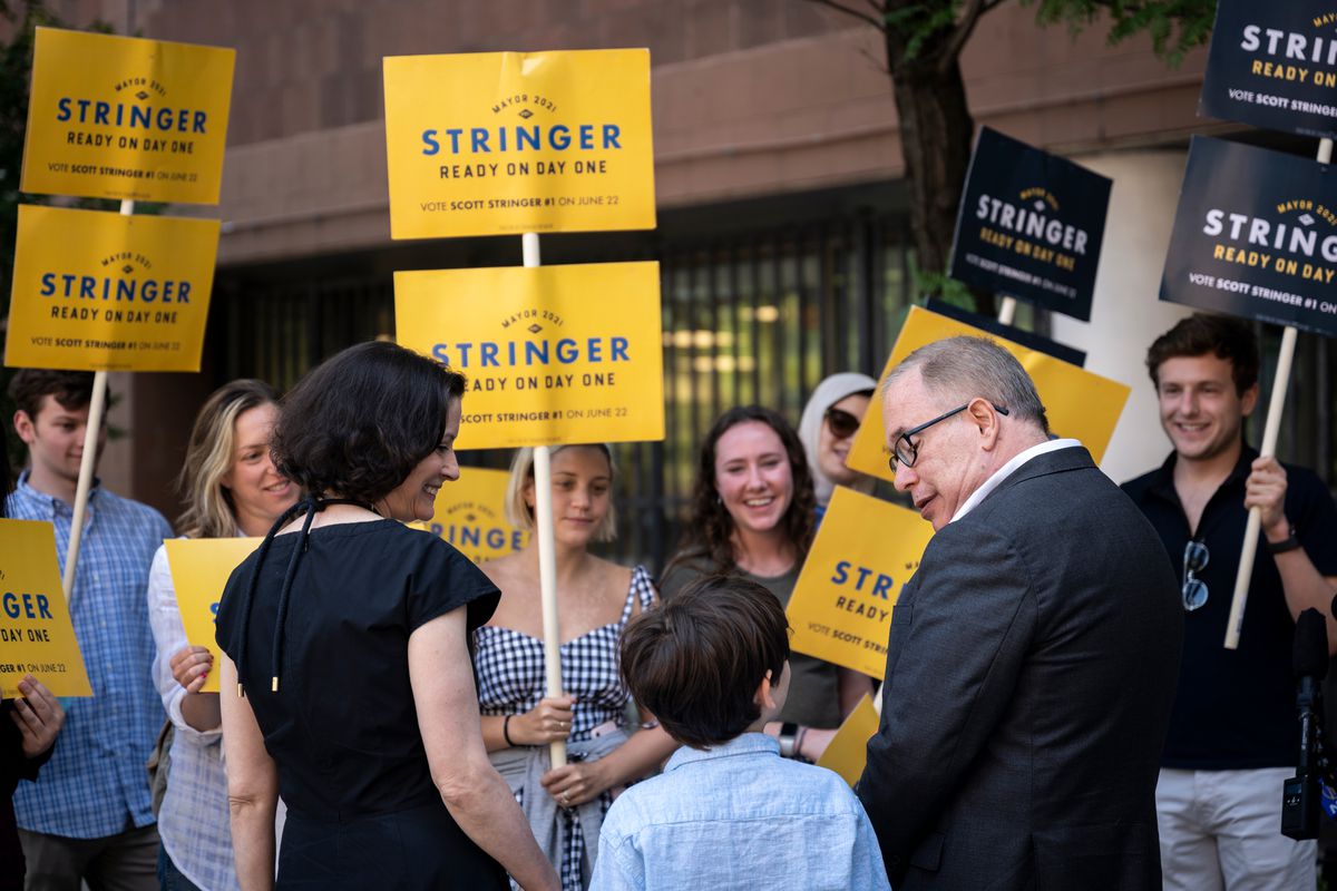 Mayoral candidate Scott Stringer is joined by his wife Elyse Buxbaum and son Miles Stringer to vote at the Borough of Manhattan Community College, June 18, 2021.