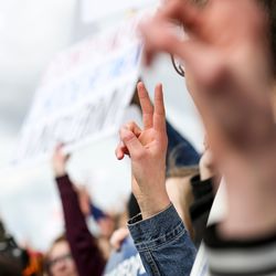 Protesters flash peace signs during the "March for Our Lives" rally at the state Capitol in Salt Lake City on Saturday, March 24, 2018. Thousands of protesters marched from West High School to the state Capitol to advocate for stricter gun control laws.