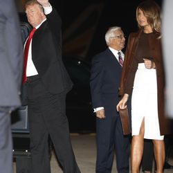 President Donald Trump and first lady Melania Trump walk from Air Force One, Thursday, Nov. 29, 2018, as they arrive in Buenos Aires, Argentina. Trump traveled to Argentina to attend the G20 summit. (AP Photo/Pablo Martinez Monsivais)