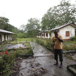 In this photo taken Tuesday, May, 8. 2012, an unidentified man is seen at the former prison known as Tekunle on Ita Oko Island outside of Lagos, Nigeria.