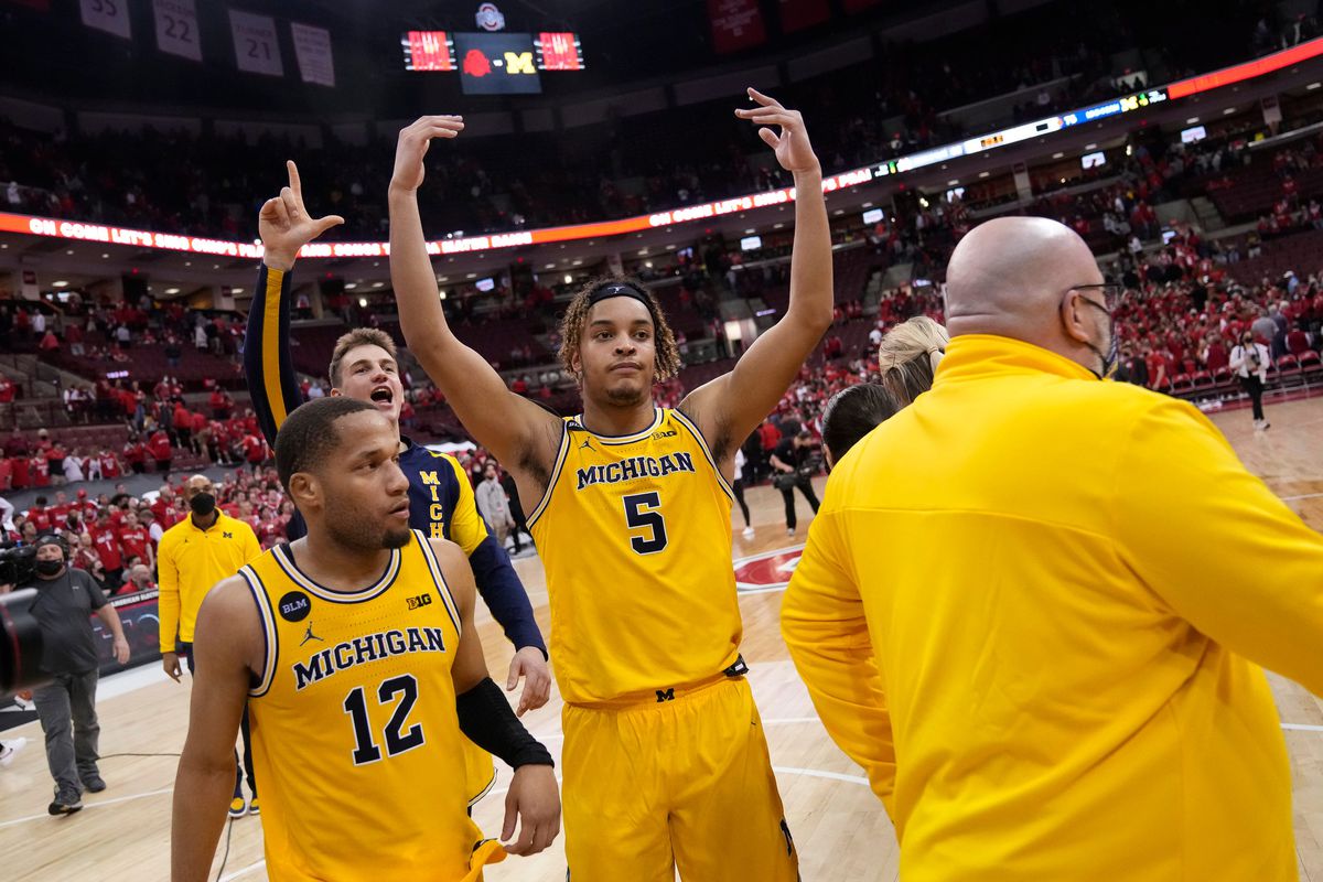 Michigan Wolverines forward Terrance Williams II and guard DeVante’ Jones leave the court following their 75-69 win over the Ohio State Buckeyes in the NCAA men’s basketball game at Value City Arena in Columbus on March 6, 2022.&nbsp;