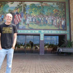 Chad Ford, BYU-Hawaii's director of the David O. McKay Center for International Cultural Understanding, in his Star Wars' "Force for Good" T-shirt. Ford, also an ESPN draft insider, is standing in front of a mosaic depicting the 1921 American flag-raising when then Elder David O. McKay visualized an institution of higher learning that would bring together and educate future international leaders.