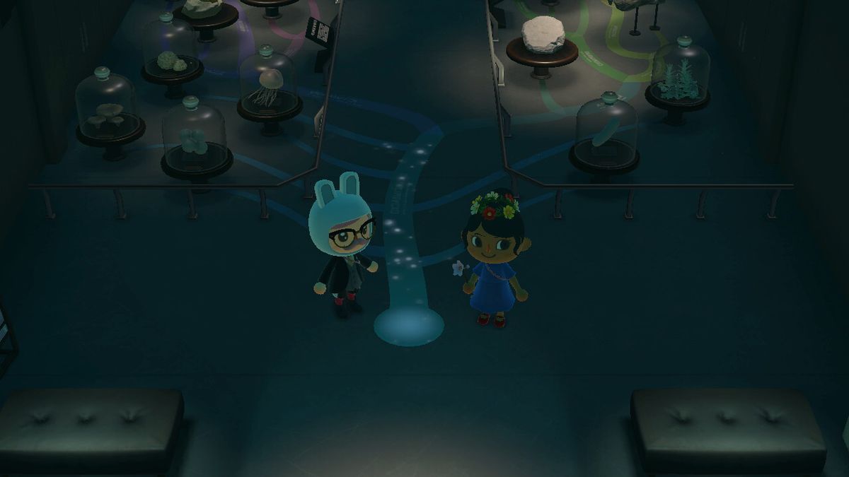 Two villagers stand in the fossil wing of the museum in Animal Crossing: New Horizons