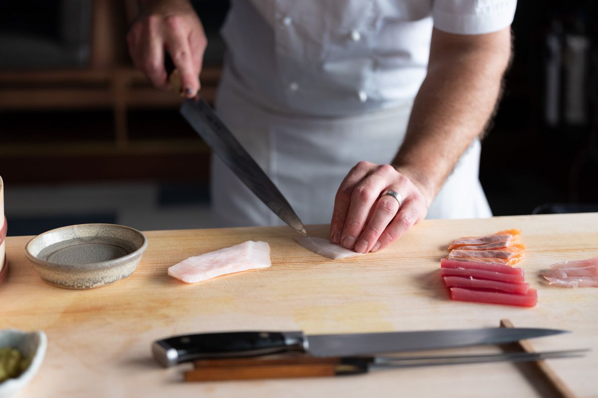 Australian Shuan Presland cuts raw fish. He will open Pacific at number 10 Heddon Street in Mayfair in November 2019