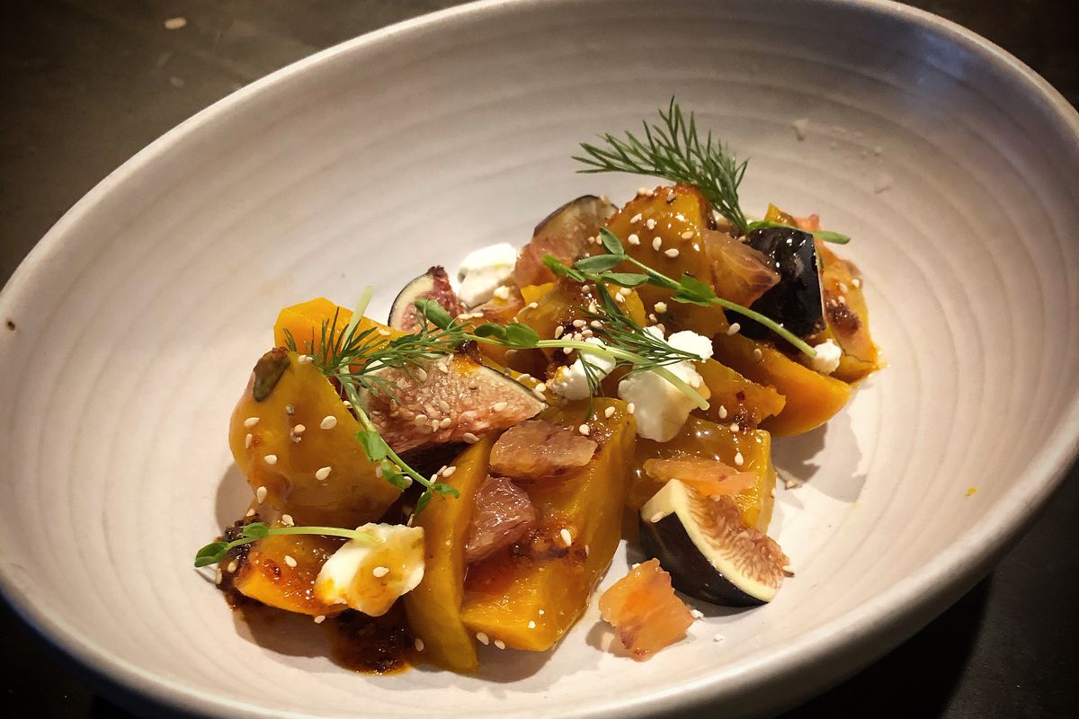 A plate of golden beets, figs, sesame seeds, and goat cheese at Chelo, a pop-up based at Magna in Portland, Oregon.