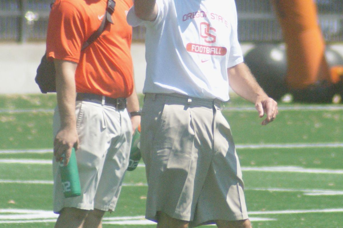 Oregon St. football head coach Mike Riley was actively engaged in installing the offense during the first day of practice for the Beavers. <em>(Photo by Andy Wooldridge)</em>