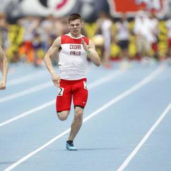 Cedar Falls’ Zach Shippy, center, finishes strong against Cedar Rapids Washington’s Landen Akers, left, and Tyler Flanders of Pleasant Valley in the third section of the 400 meter dash at Drake Stadium during the Iowa High School State Track and Field Championships Thursday, May 22, 2014, in Des Moines. 