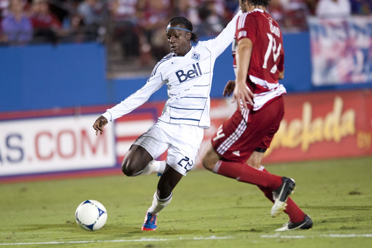 FRISCO, TX - SEPTEMBER 15:  Darren Mattocks #22 of the Vancouver Whitecaps FC crosses in the ball against FC Dallas on September 15, 2012 at FC Dallas Stadium in Frisco, Texas.  (Photo by Cooper Neill/Getty Images)