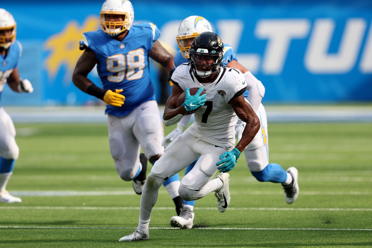 Zay Jones #7 of the Jacksonville Jaguars rushes with the ball during a game against the Los Angeles Chargers at SoFi Stadium on September 25, 2022 in Inglewood, California.