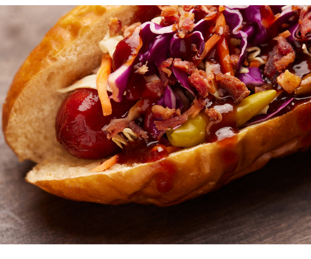 A hot dog with toppings.