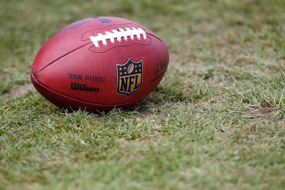 An NFL football sits on the practice field during the Pittsburgh Steelers training camp on July 29, 2011 at St Vincent College in Latrobe, Pennsylvania.