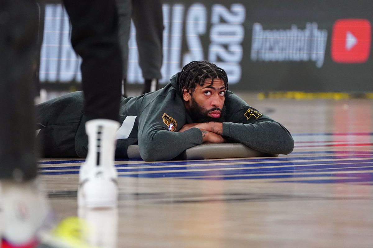 Anthony Davis of the Los Angeles Lakers stretches on the court before Game Five of the NBA Finals against the Miami Heat on October 9, 2020 in Orlando, Florida at AdventHealth Arena.&nbsp;